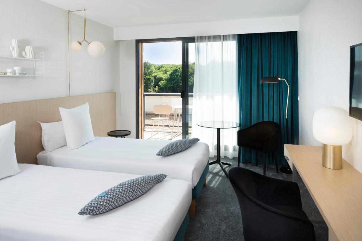 Un ou plusieurs lits dans un hébergement de l'établissement Best Western Plus Hotel les Rives du Ter