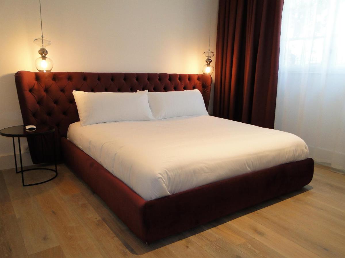 Un ou plusieurs lits dans un hébergement de l'établissement Hôtel Ginkgo - SPA Biloba