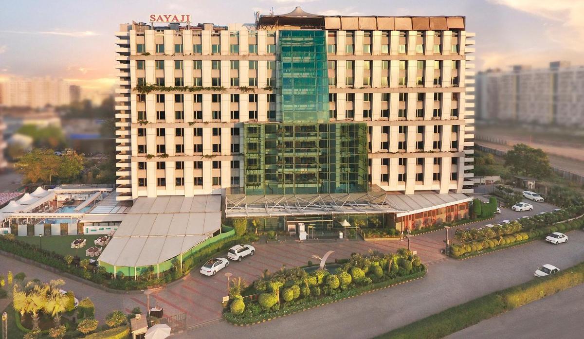 an overhead view of a large building with a parking lot at Sayaji Pune in Pune