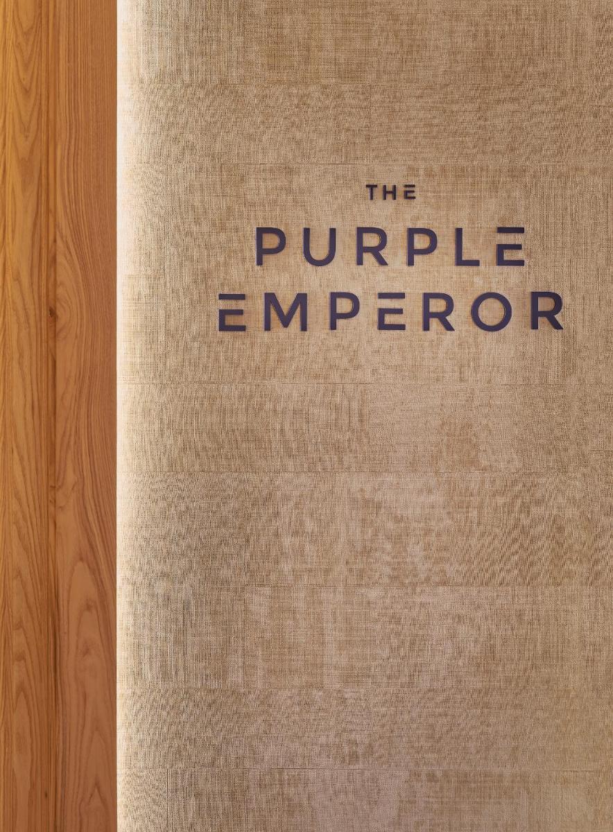 a book that says the purple emperor on the cover at The Den, Bengaluru in Bengaluru