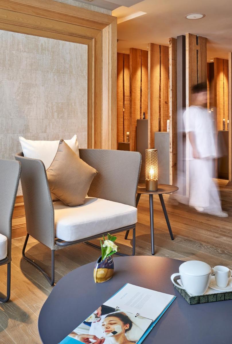 a living room with a couch and a table at The Den, Bengaluru in Bengaluru