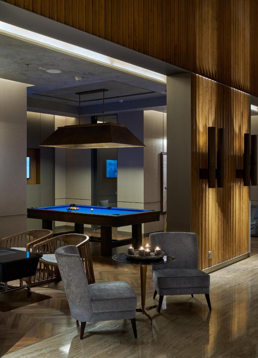 a dining room with a ping pong table and chairs at The Den, Bengaluru in Bengaluru