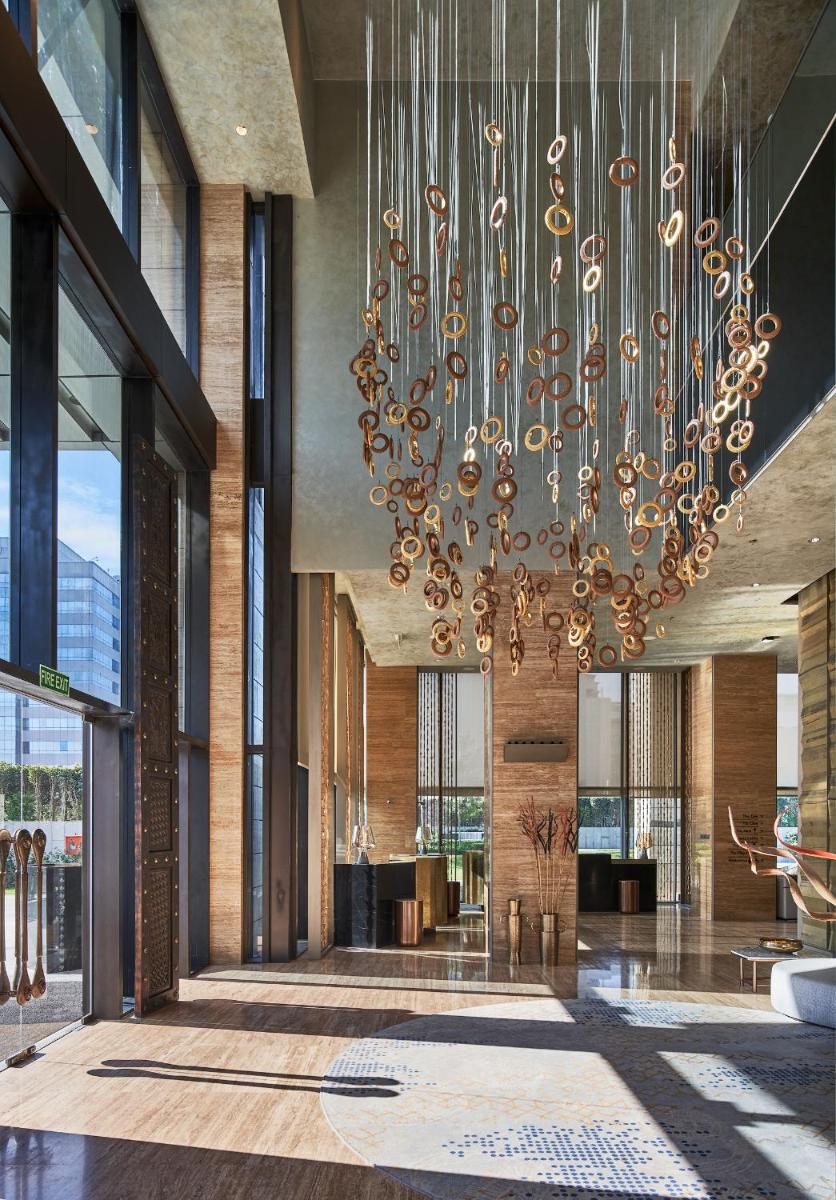 a large chandelier in the lobby of a building at The Den, Bengaluru in Bengaluru