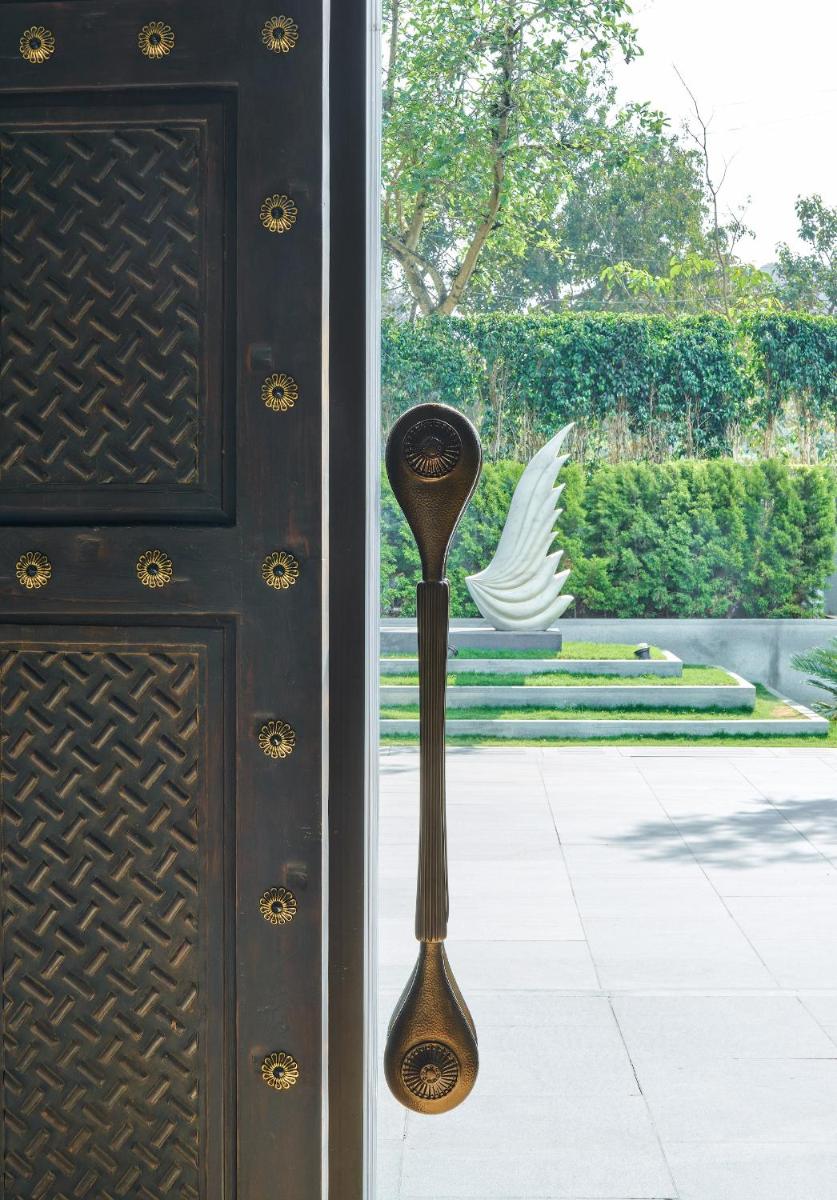 a door with a spoon sticking out of it at The Den, Bengaluru in Bengaluru