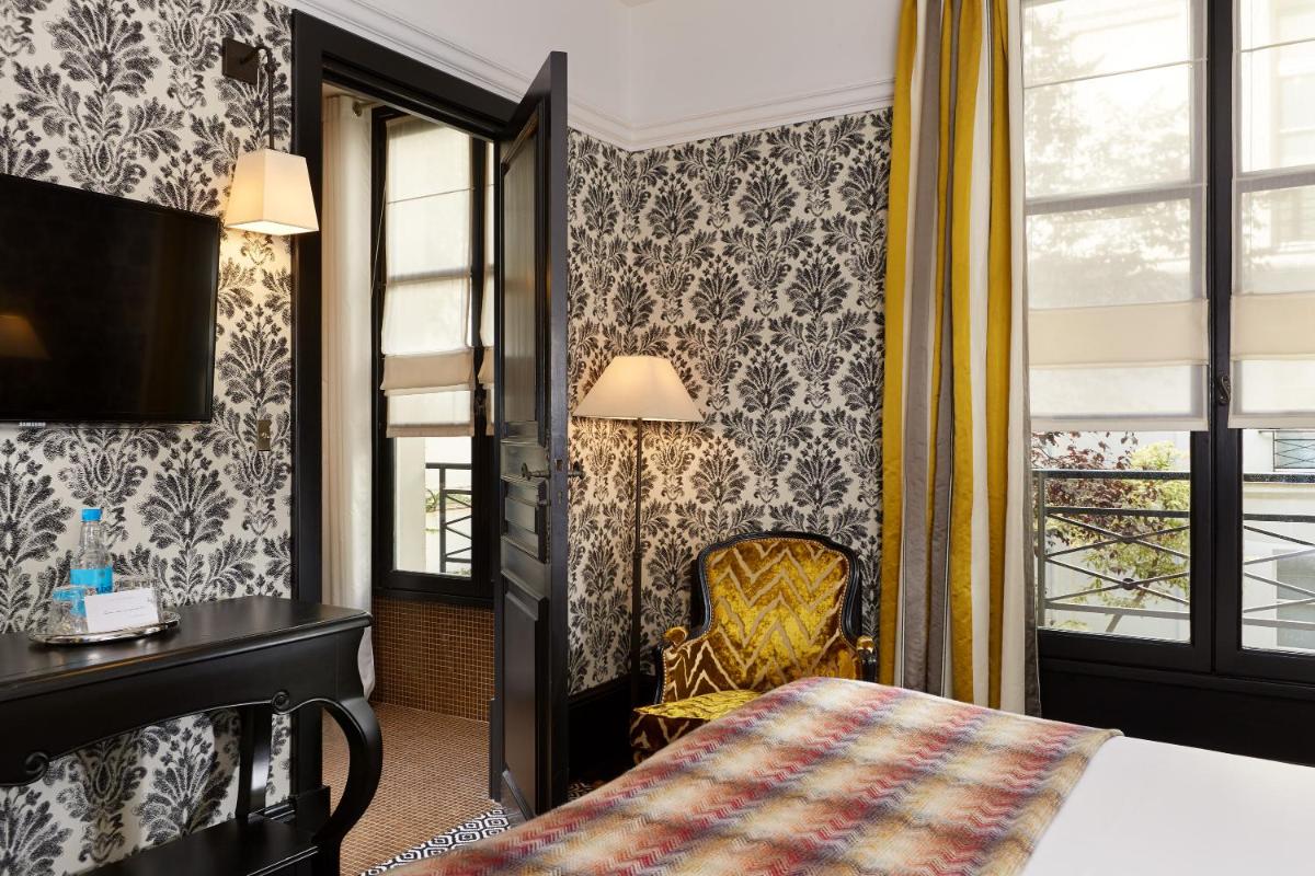Un ou plusieurs lits dans un hébergement de l'établissement Le Pavillon de la Reine & Spa, Place des Vosges