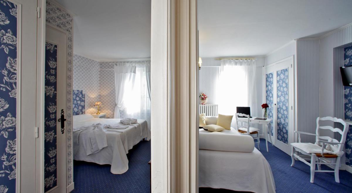 Un ou plusieurs lits dans un hébergement de l'établissement Logis Hôtel Restaurant Château Bellevue