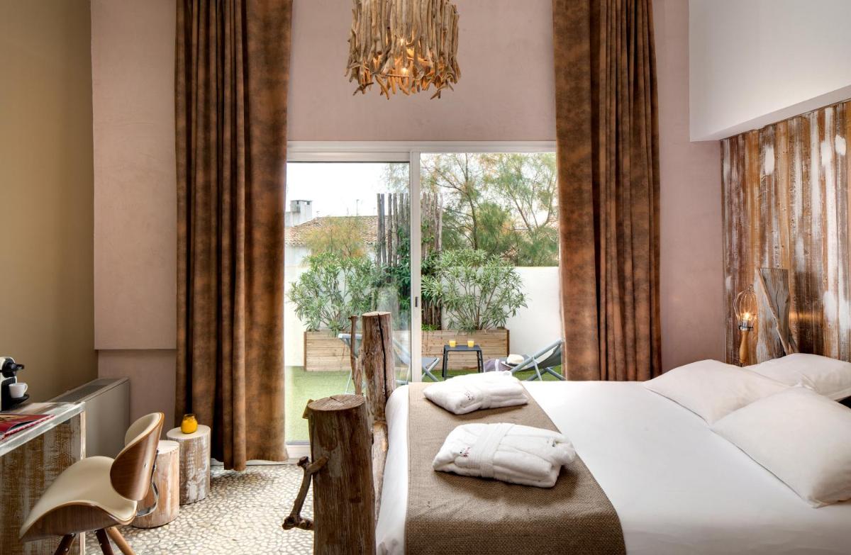Un ou plusieurs lits dans un hébergement de l'établissement Vila De La Mar & Spa