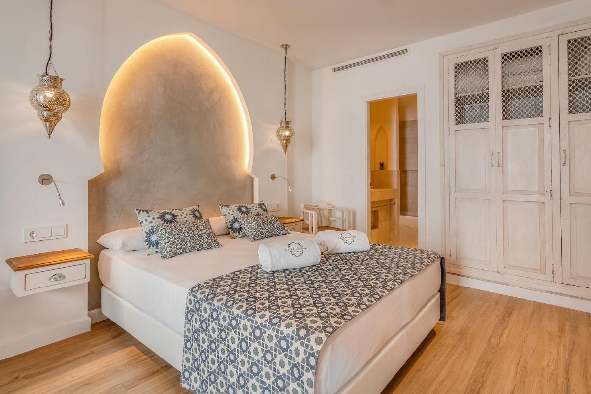 Cama o camas de una habitación en La Residencia Puerto Hotel & Spa