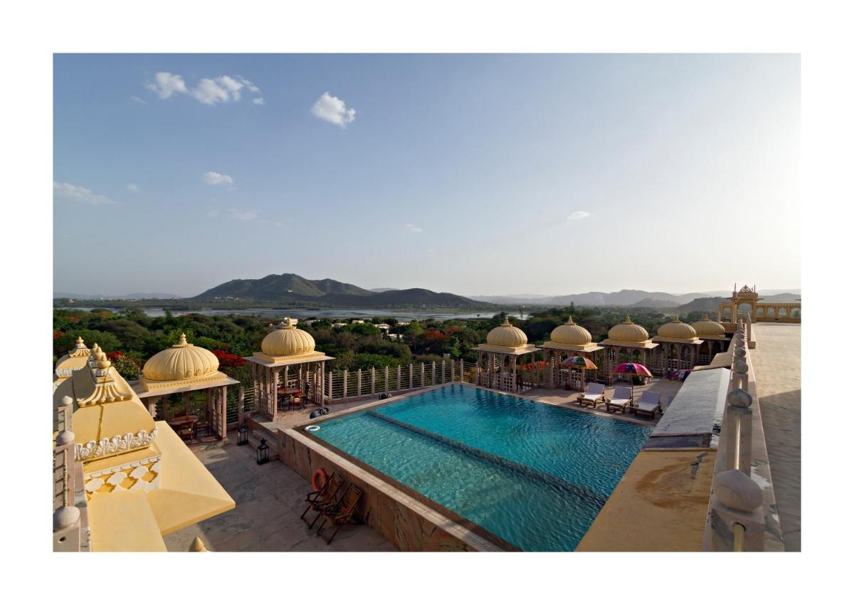 a view of a swimming pool on top of a building at Chunda Palace in Udaipur