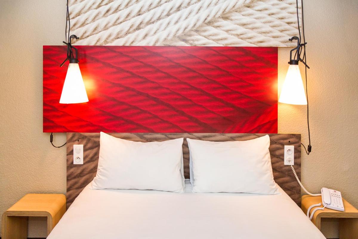 Un ou plusieurs lits dans un hébergement de l'établissement ibis La Baule Pornichet Plage