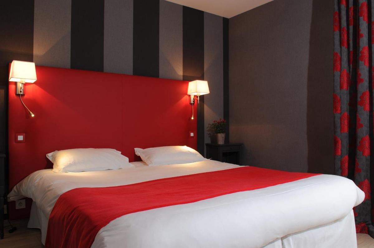 Un ou plusieurs lits dans un hébergement de l'établissement Hôtel Lutétia & Spa