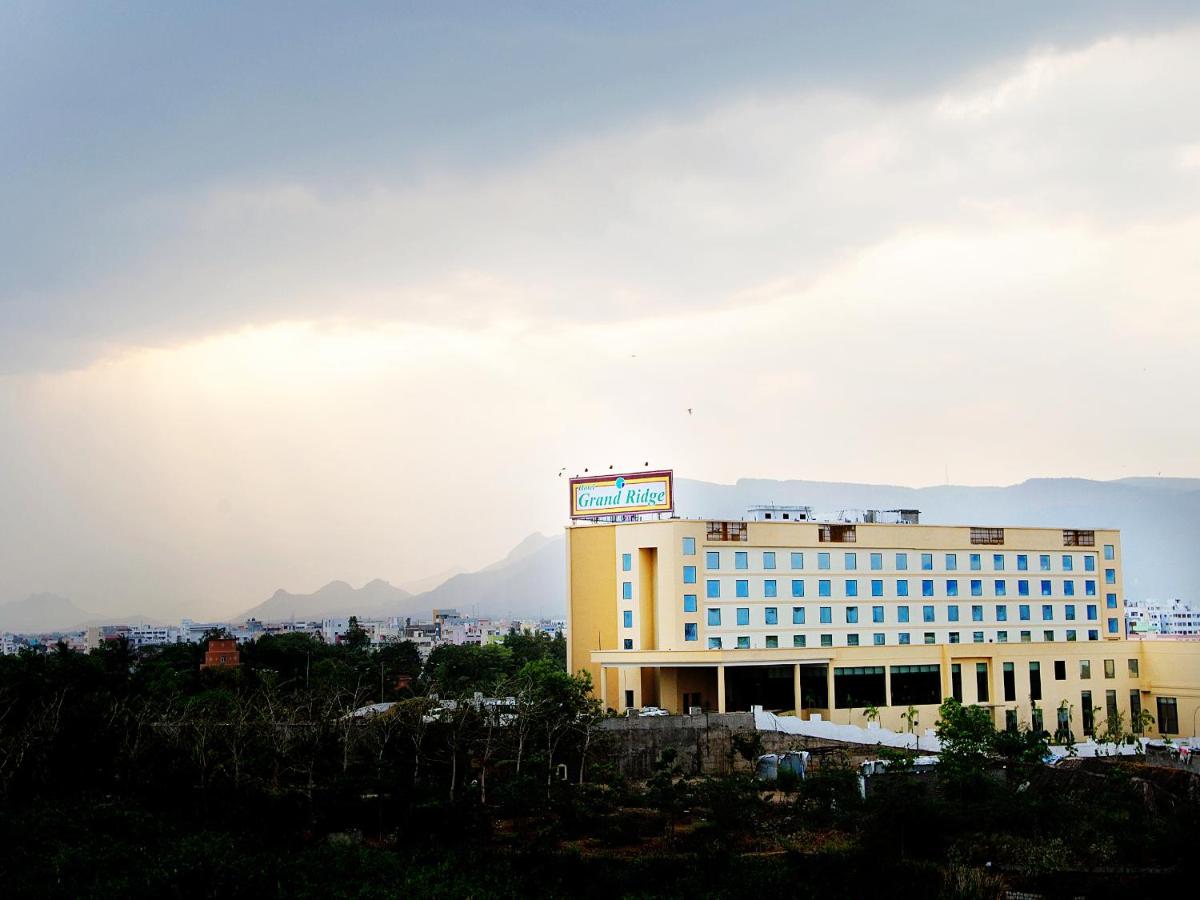 a hotel building with a mountain in the background at Fortune Select Grand Ridge, Tirupati - Member ITC Hotels' Group in Tirupati