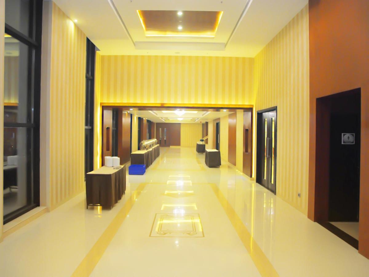 a hallway in a building with couches in the middle at Fortune Select Grand Ridge, Tirupati - Member ITC Hotels' Group in Tirupati