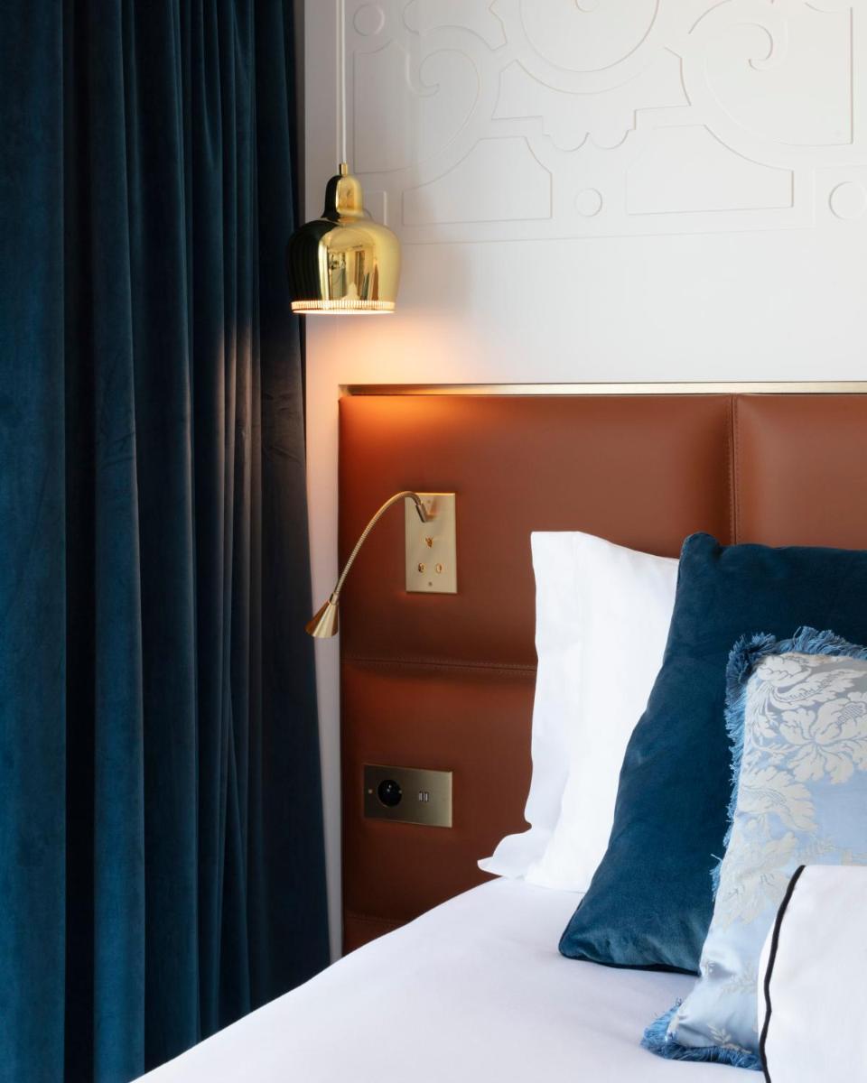 Un ou plusieurs lits dans un hébergement de l'établissement Hotel Bowmann
