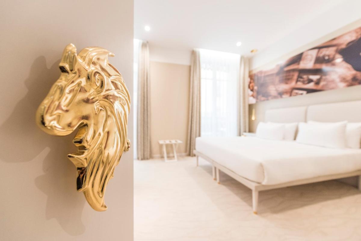 Un ou plusieurs lits dans un hébergement de l'établissement Boscolo Lyon Hotel & Spa