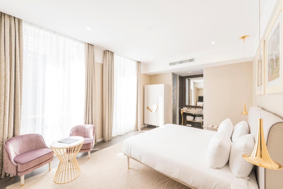 Un ou plusieurs lits dans un hébergement de l'établissement Boscolo Lyon Hotel & Spa
