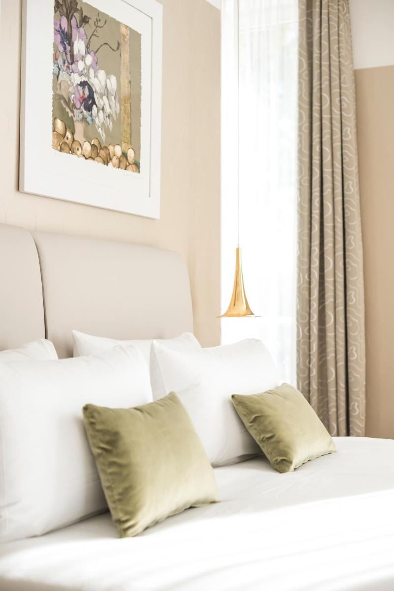 Un ou plusieurs lits dans un hébergement de l'établissement Boscolo Lyon Hotel & Spa