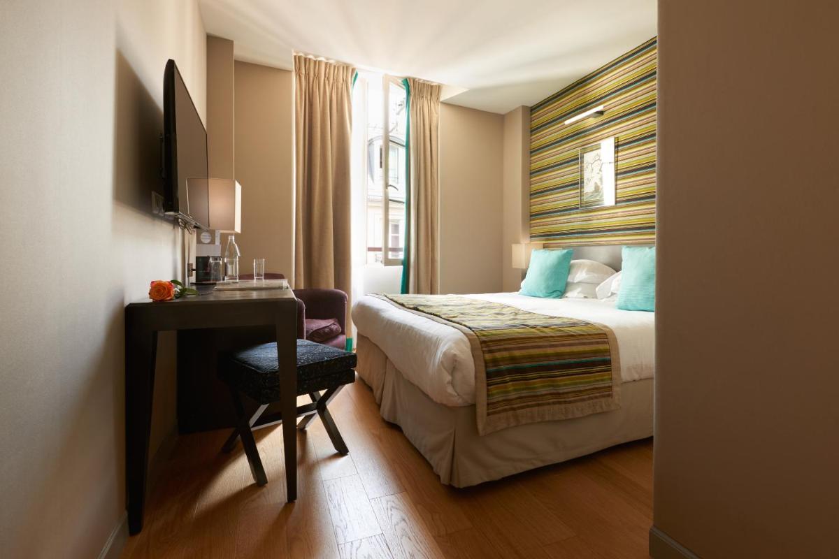Un ou plusieurs lits dans un hébergement de l'établissement Le Mathurin Hotel & Spa