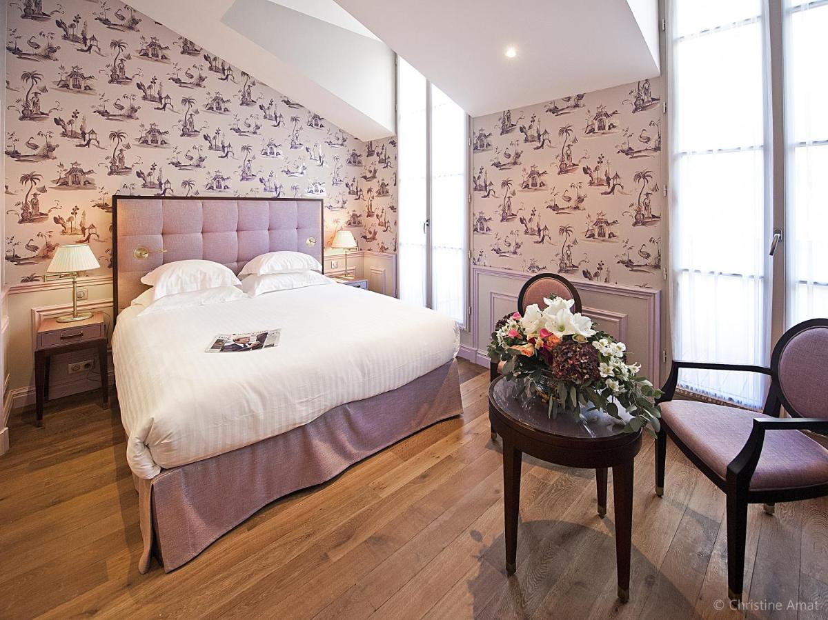 Un ou plusieurs lits dans un hébergement de l'établissement Hôtel de Sèze & Spa Bordeaux Centre