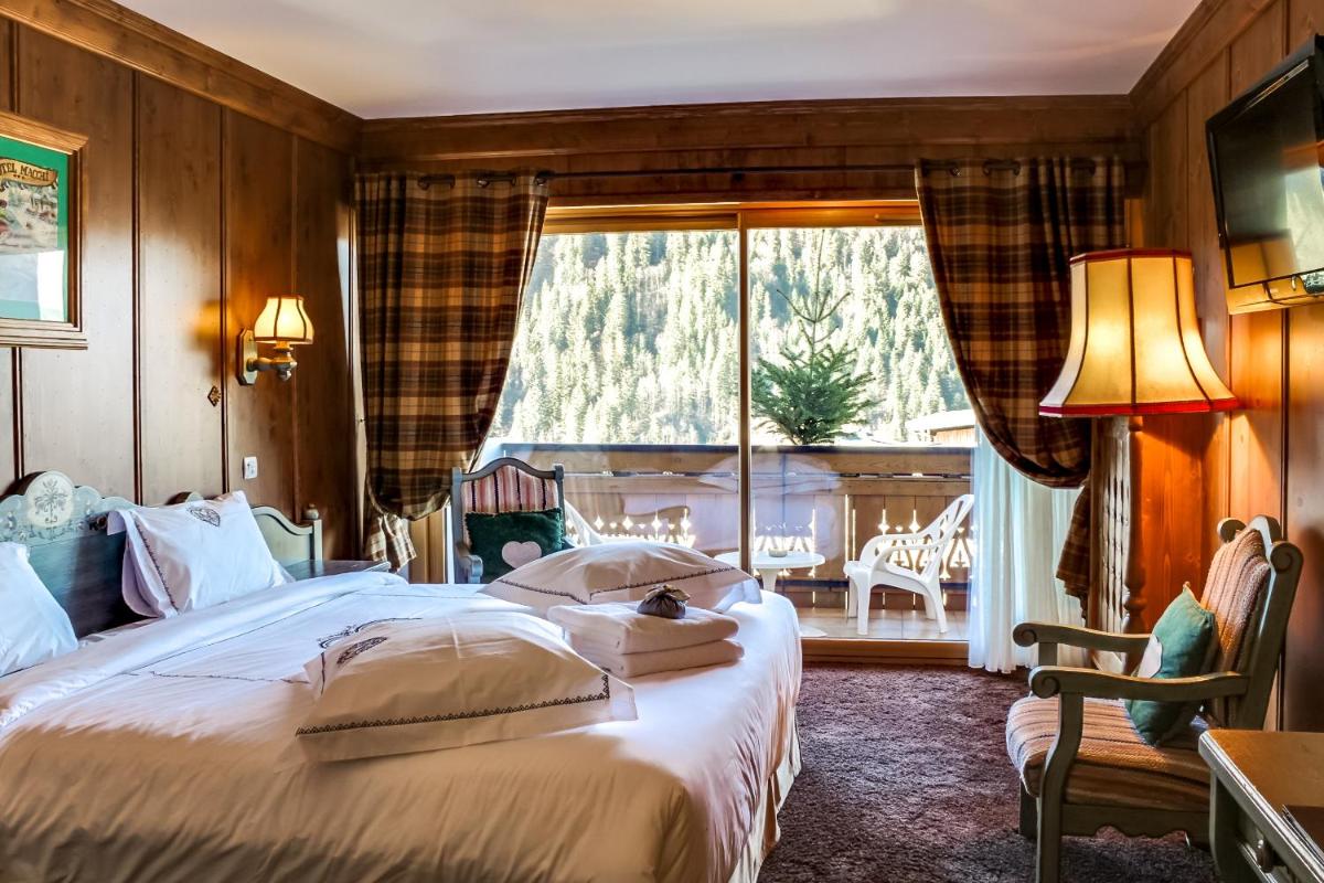 Un ou plusieurs lits dans un hébergement de l'établissement Hôtel Macchi Restaurant & Spa