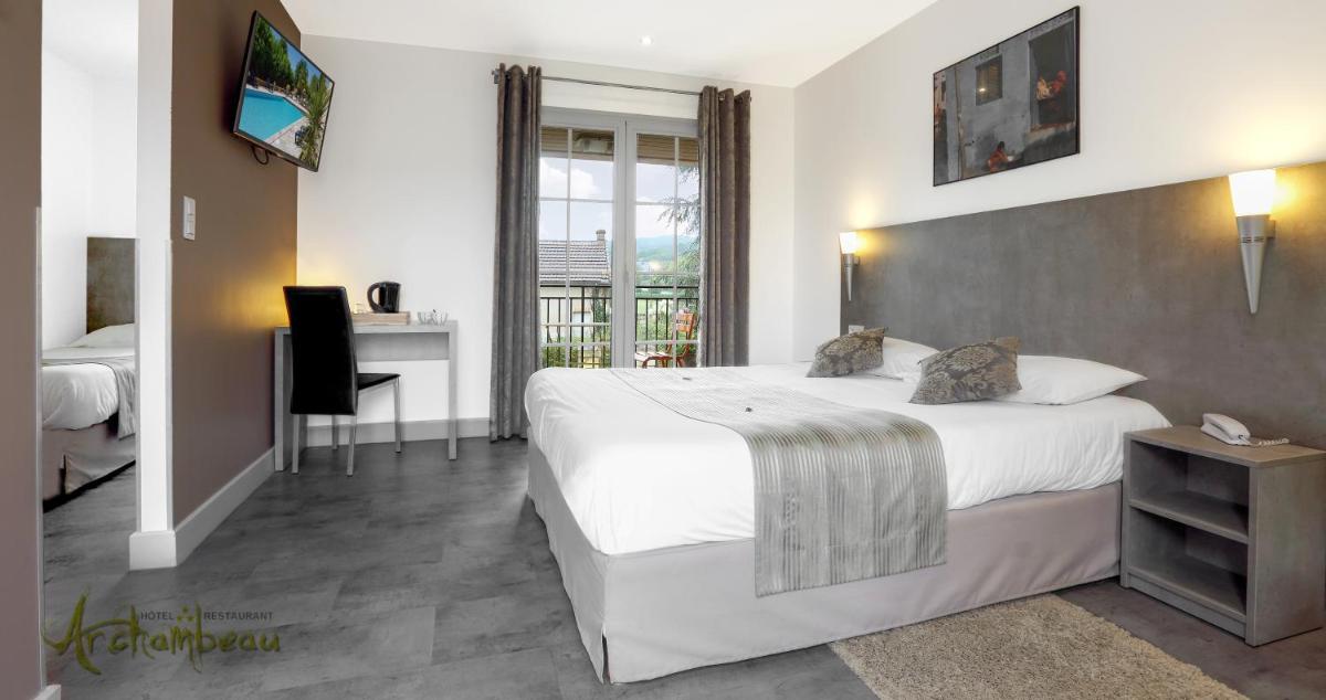 Un ou plusieurs lits dans un hébergement de l'établissement Logis Hotel Archambeau