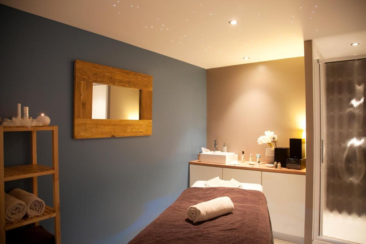 Un ou plusieurs lits dans un hébergement de l'établissement Best Western Hôtel Garden and Spa