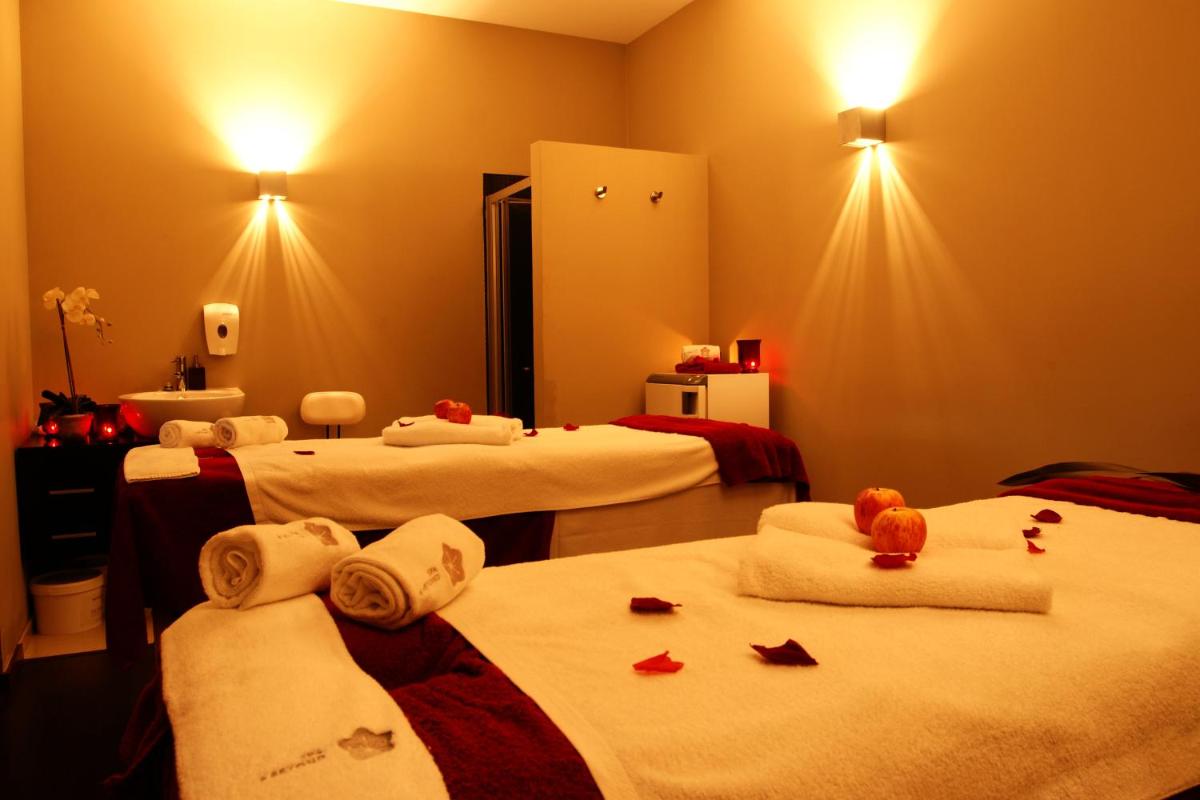 Uma cama ou camas num quarto em Your Hotel & Spa Alcobaça