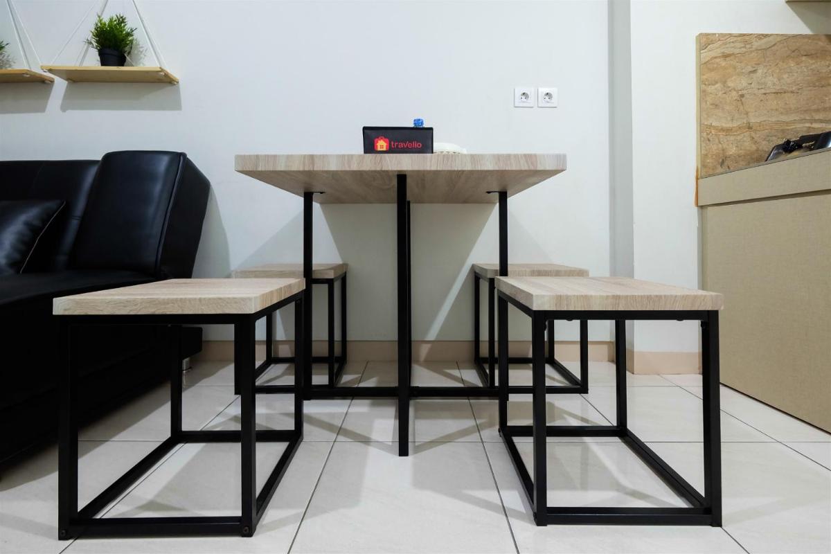 2BR with Sofa Bed The Springlake Summarecon Bekasi Apartment By Travelio - Housity