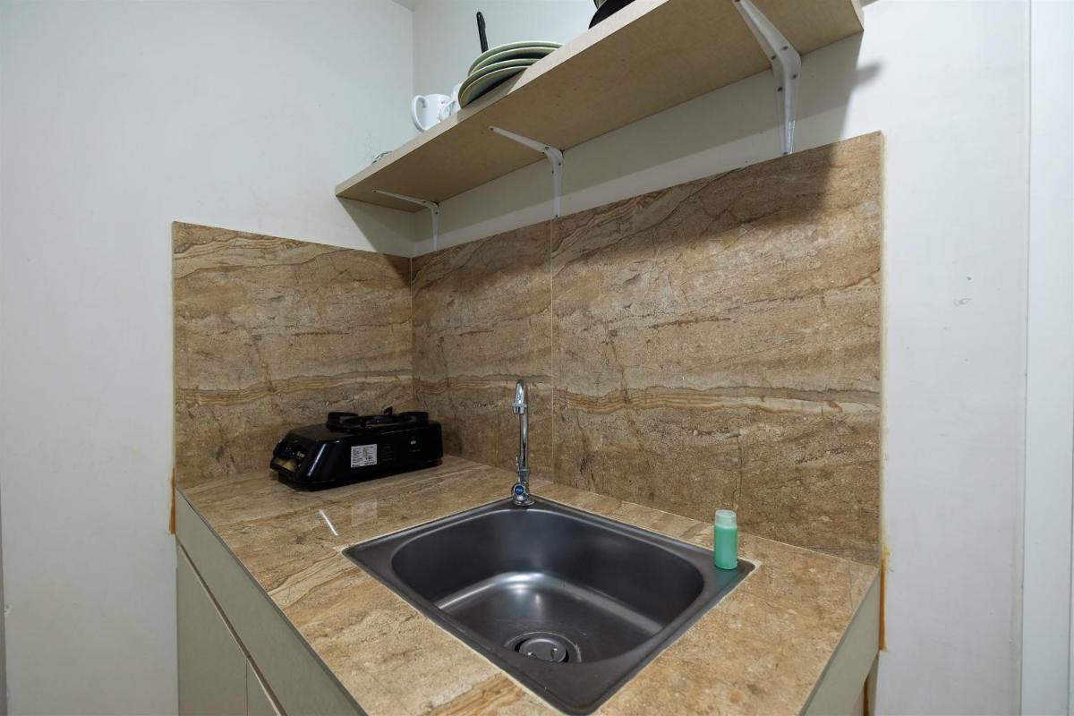 2BR with Sofa Bed The Springlake Summarecon Bekasi Apartment By Travelio - Housity
