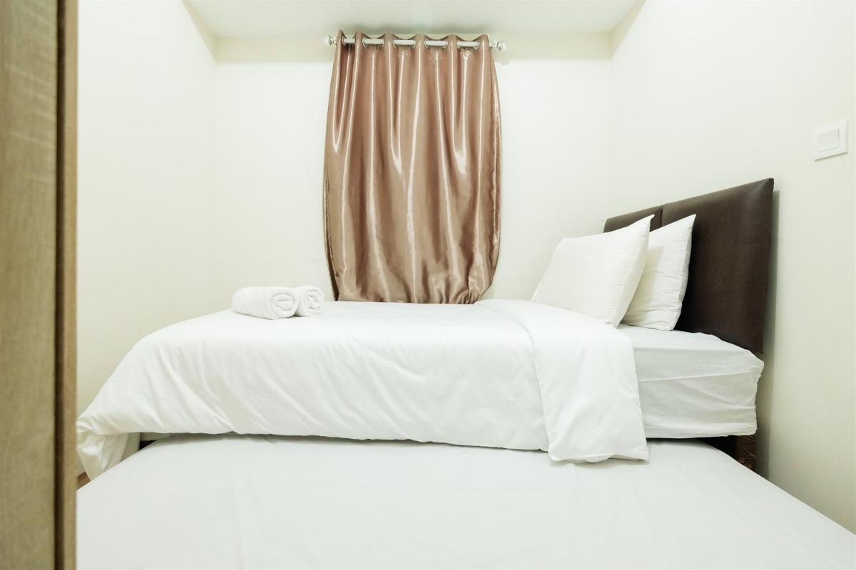 2BR with Sofa Bed The Springlake Summarecon Bekasi Apartment By Travelio - Housity