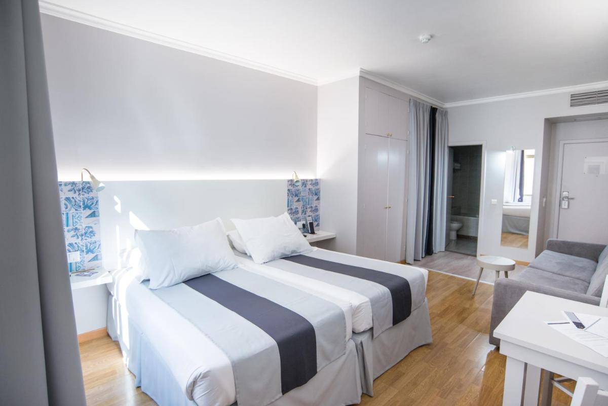 Uma cama ou camas num quarto em Sé Boutique Hotel
