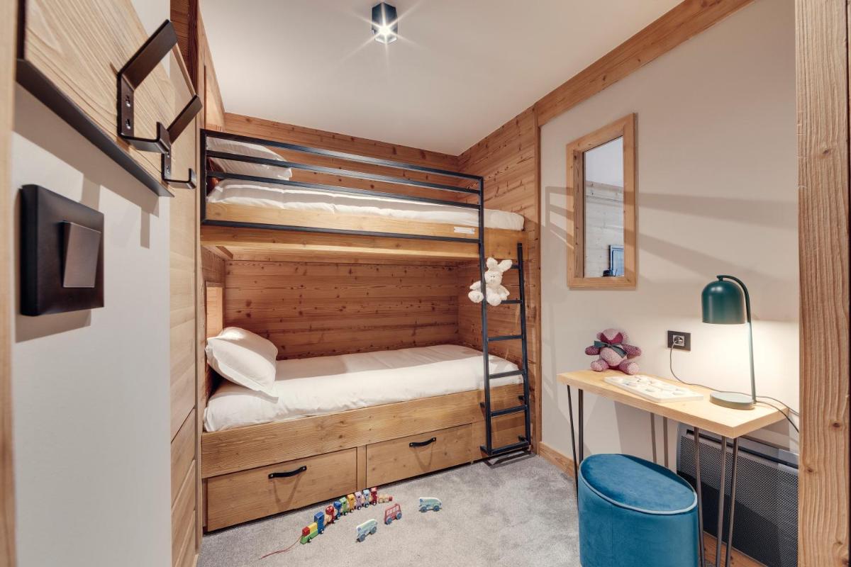 Un ou plusieurs lits dans un hébergement de l'établissement Hôtel Avancher