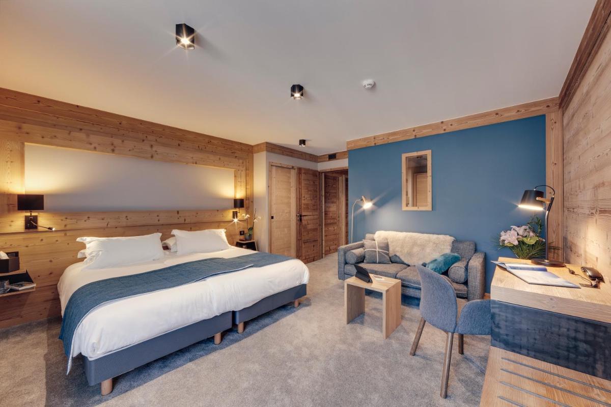 Un ou plusieurs lits dans un hébergement de l'établissement Hôtel Avancher