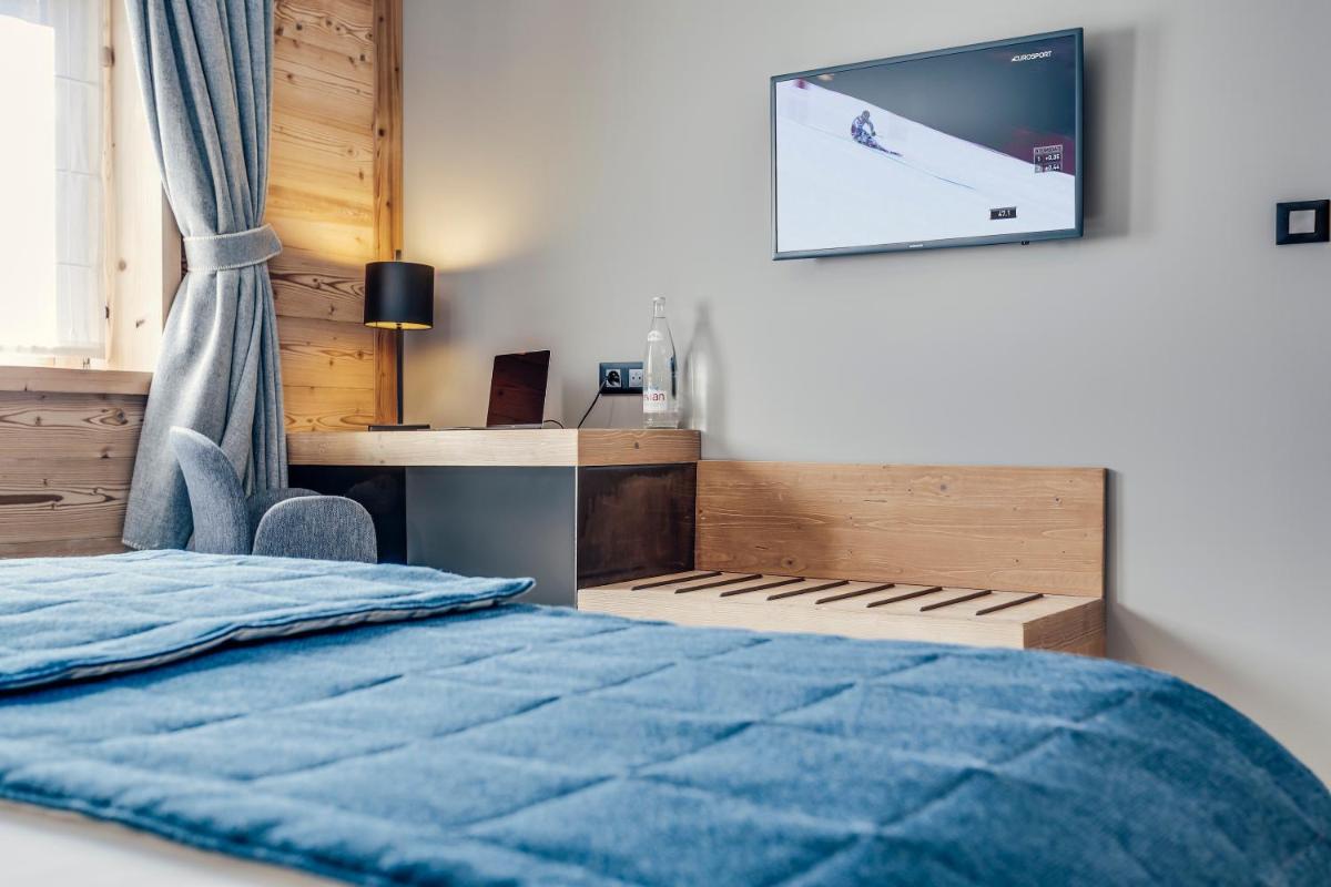 Un ou plusieurs lits dans un hébergement de l'établissement Hôtel Avancher