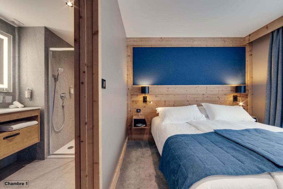 Un ou plusieurs lits dans un hébergement de l'établissement Hôtel Avancher