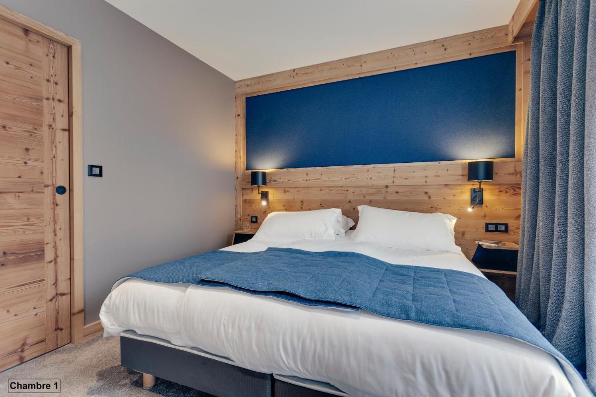 Un ou plusieurs lits dans un hébergement de l'établissement Hôtel Avancher