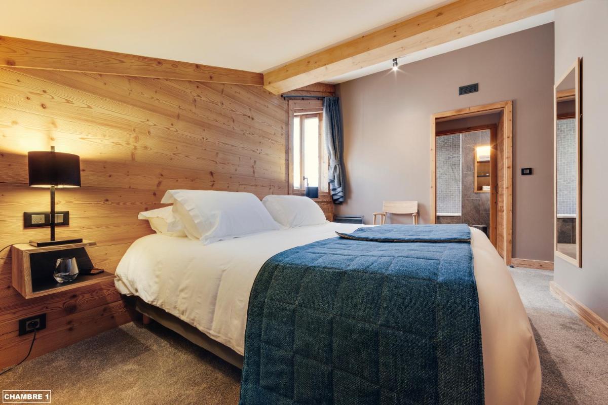 Un ou plusieurs lits dans un hébergement de l'établissement Hôtel Avancher