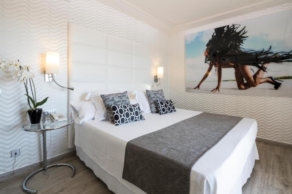 Cama o camas de una habitación en Ibiza Corso Hotel & Spa