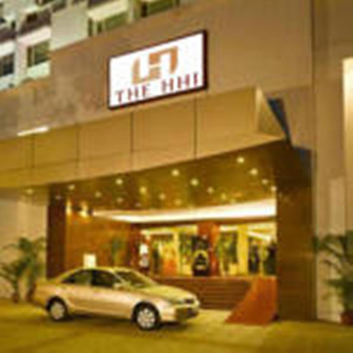 a car parked in front of a building at Hotel Hindusthan International, Kolkata in Kolkata