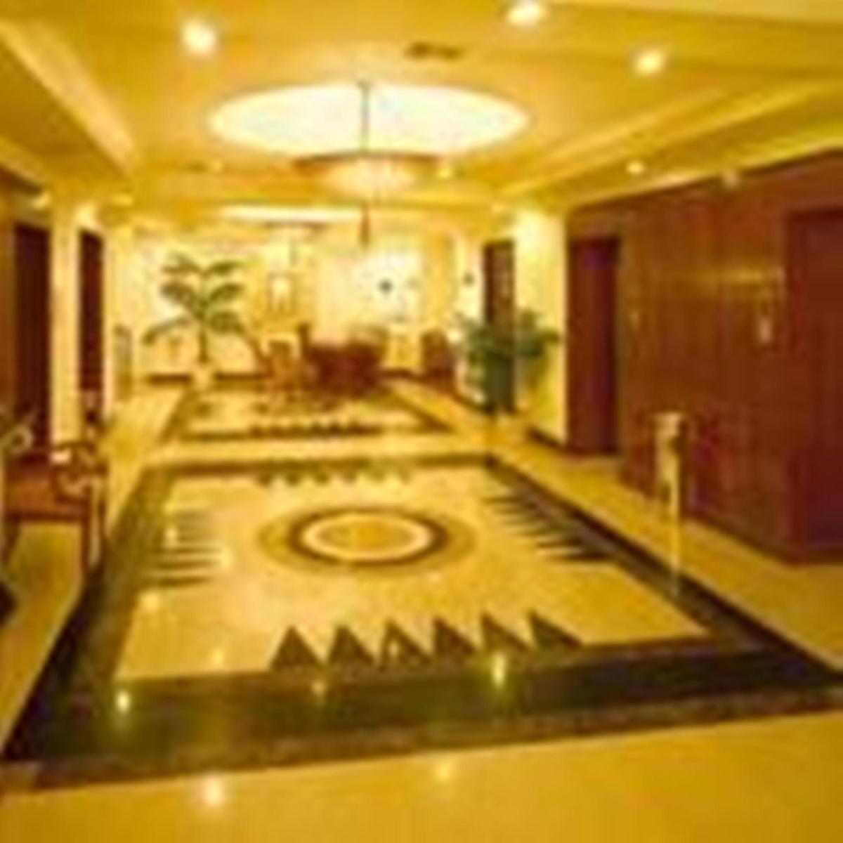 a large room with a lobby with a large floor at Hotel Hindusthan International, Kolkata in Kolkata