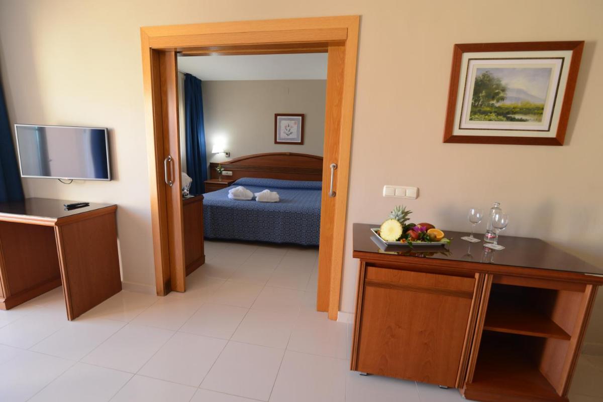 Cama o camas de una habitación en Bahía Tropical