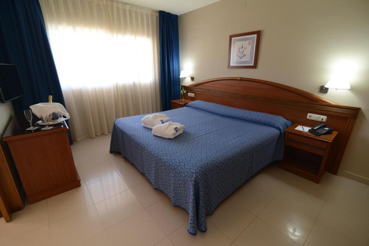 Cama o camas de una habitación en Bahía Tropical