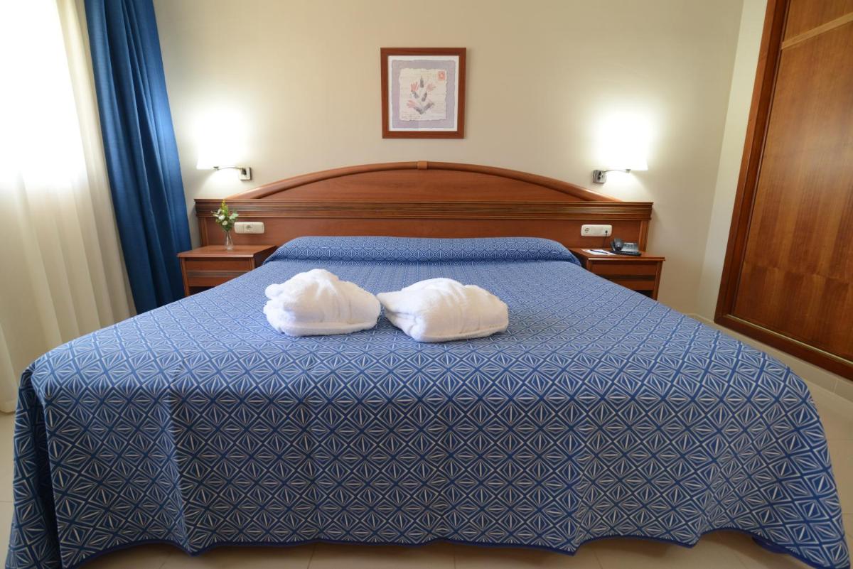 Cama o camas de una habitación en Bahía Tropical
