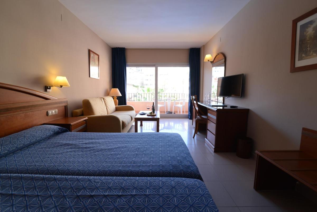 Cama o camas de una habitación en Bahía Tropical