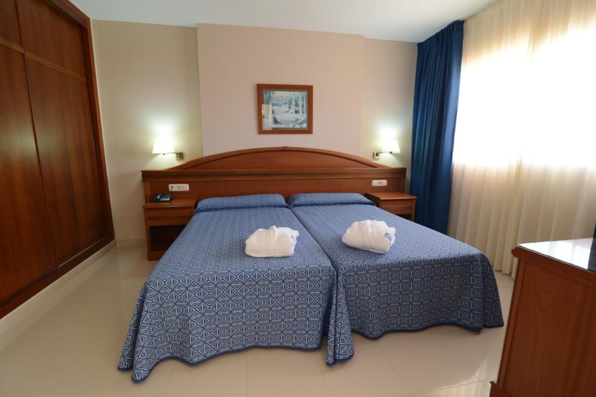 Cama o camas de una habitación en Bahía Tropical
