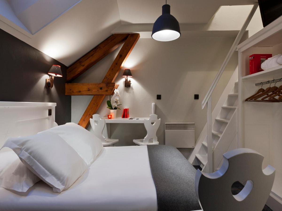 Un ou plusieurs lits dans un hébergement de l'établissement Le Faucigny - Hotel de Charme & SPA