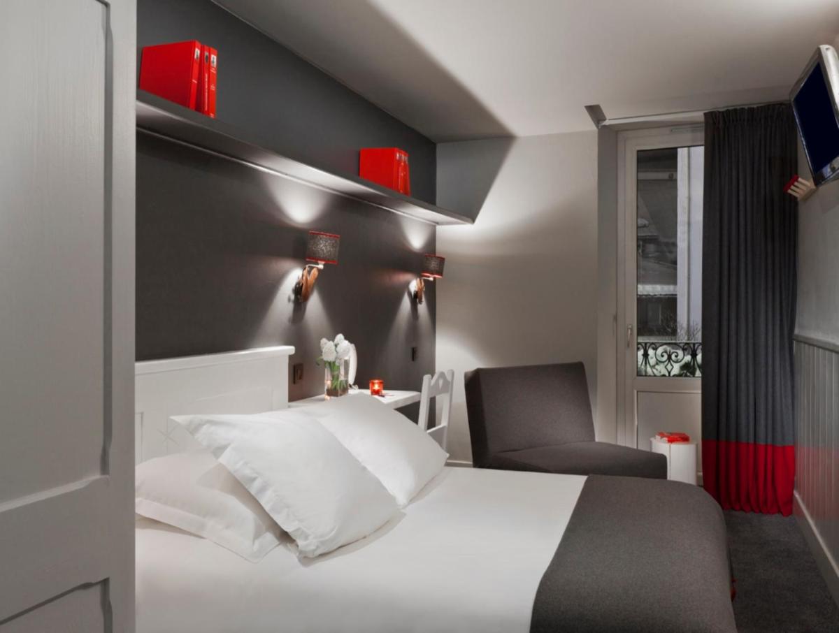 Un ou plusieurs lits dans un hébergement de l'établissement Le Faucigny - Hotel de Charme & SPA