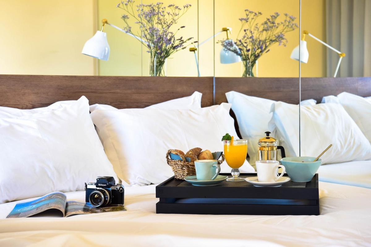 Uma cama ou camas num quarto em The Prime Energize Hotel & SPA - Algarve