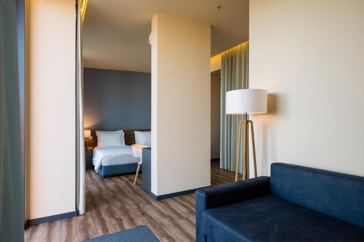 Uma cama ou camas num quarto em The Prime Energize Hotel & SPA - Algarve