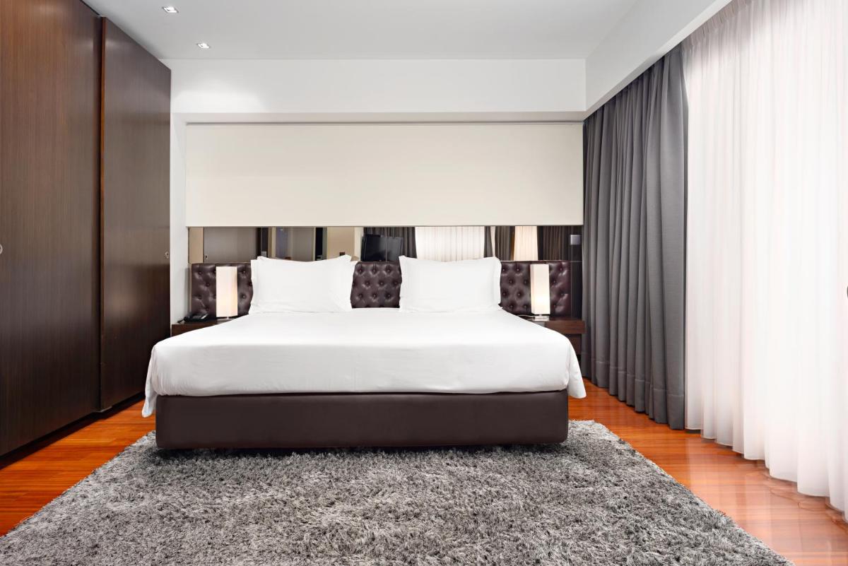 Uma cama ou camas num quarto em Hotel dos Zimbros